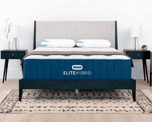 Bear Elite Hybrid mattress on bed frame between two nightstands