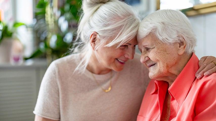 two older women with heads together