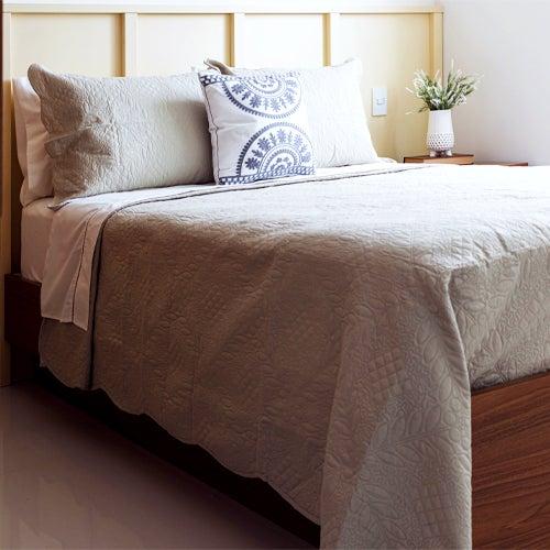 Relaxing bed with a plant on bedside table