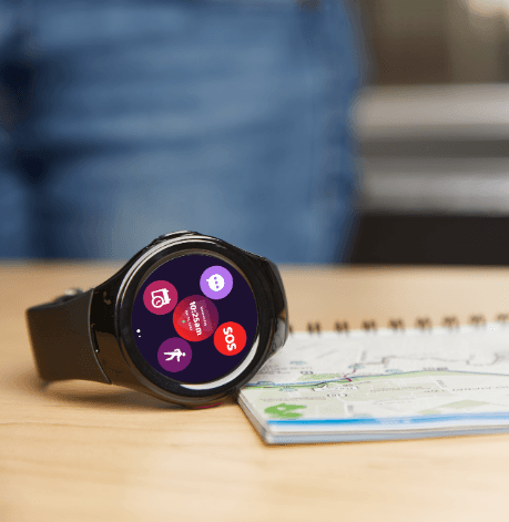 a medical alert watch on top of a table