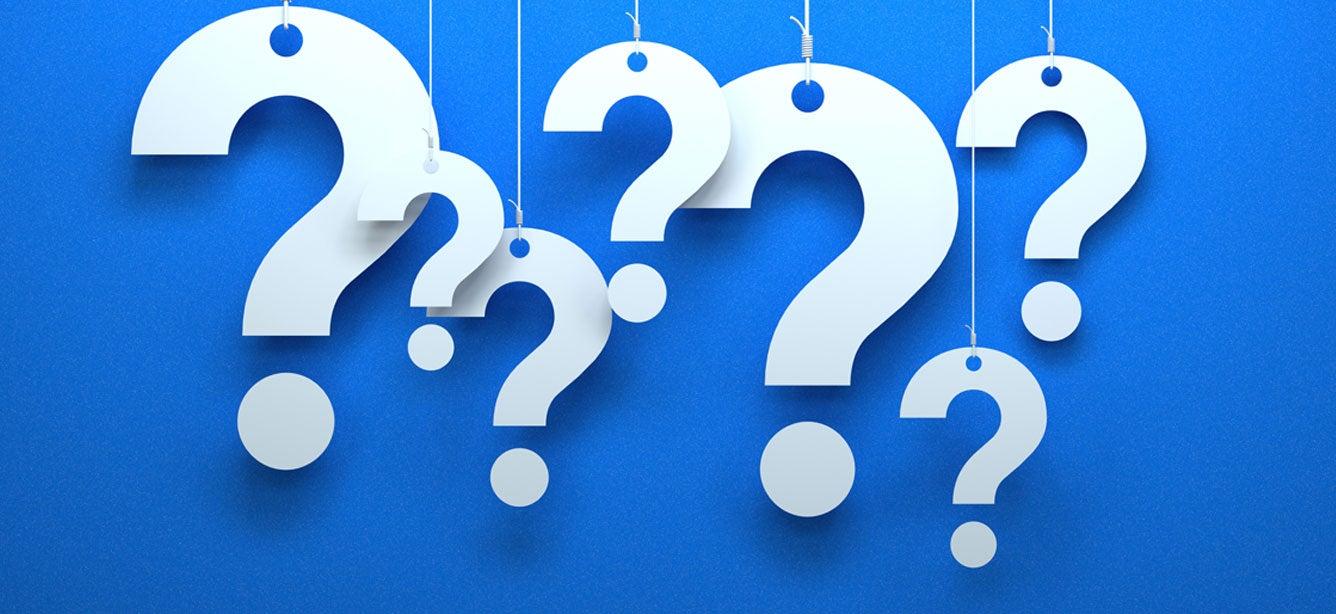 White question marks of varying heights against a solid blue background, evoking a thoughtful and inquisitive atmosphere.