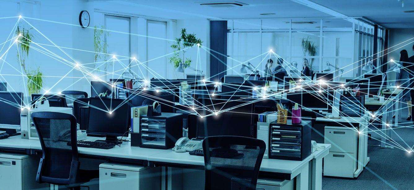 Modern office with multiple desks and computers, enhanced by soft lighting and diagonal lines suggesting digital networks.