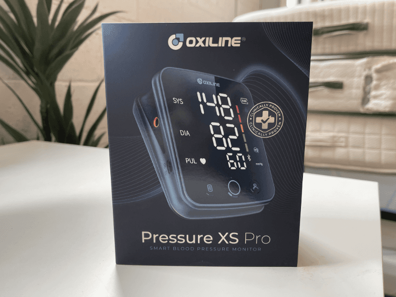 The Oxiline Pressure XS Pro sitting on a table in its box
