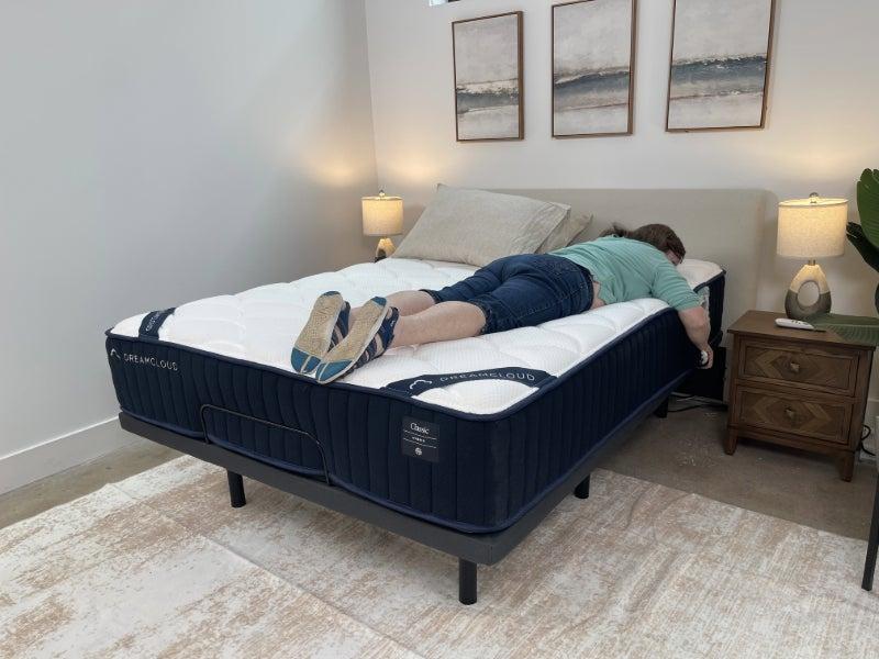 Person lying face-down on the DreamCloud Classic Hybrid