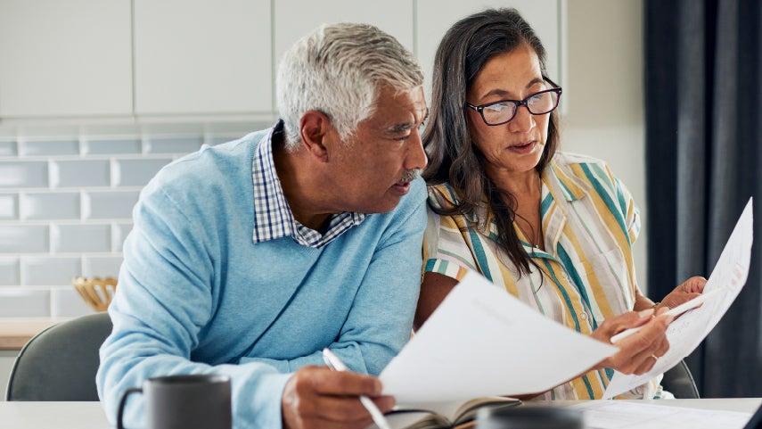 Man and woman reviewing papers.
