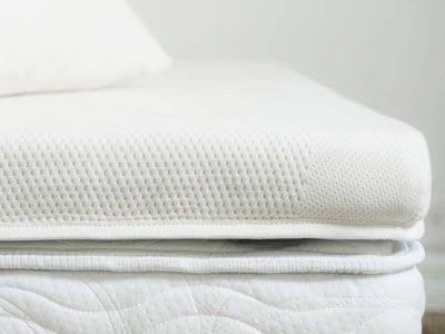 The Saatva Graphite Memory Foam mattress topper