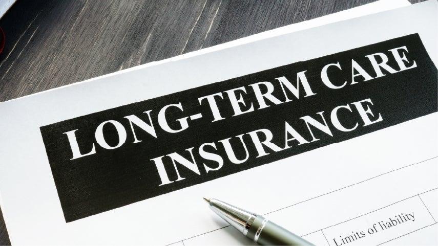 Close up shot of a piece of paper that says 'Long-Term Care Insurance' at the top in large writing.