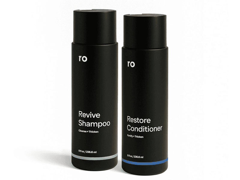 A bottle of Ro Revive Shampoo and a bottle of Ro Restore Conditioner