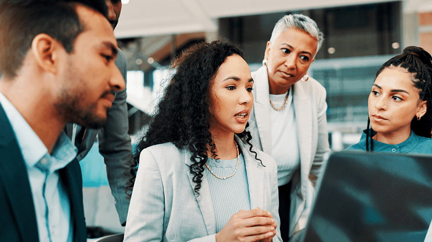 office workers looking at computer screen
