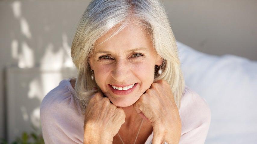 smiling woman with thick gray hair