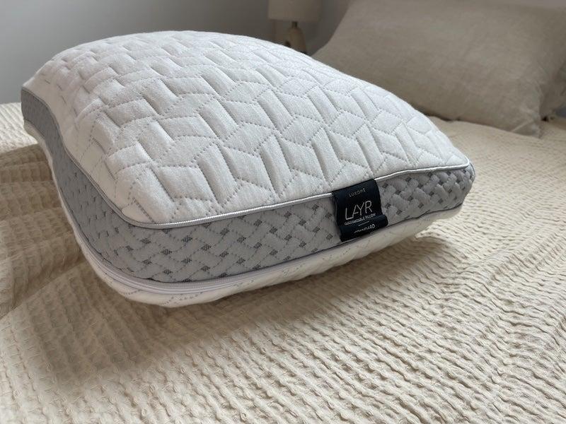 The Luxome LAYR pillow on a bed