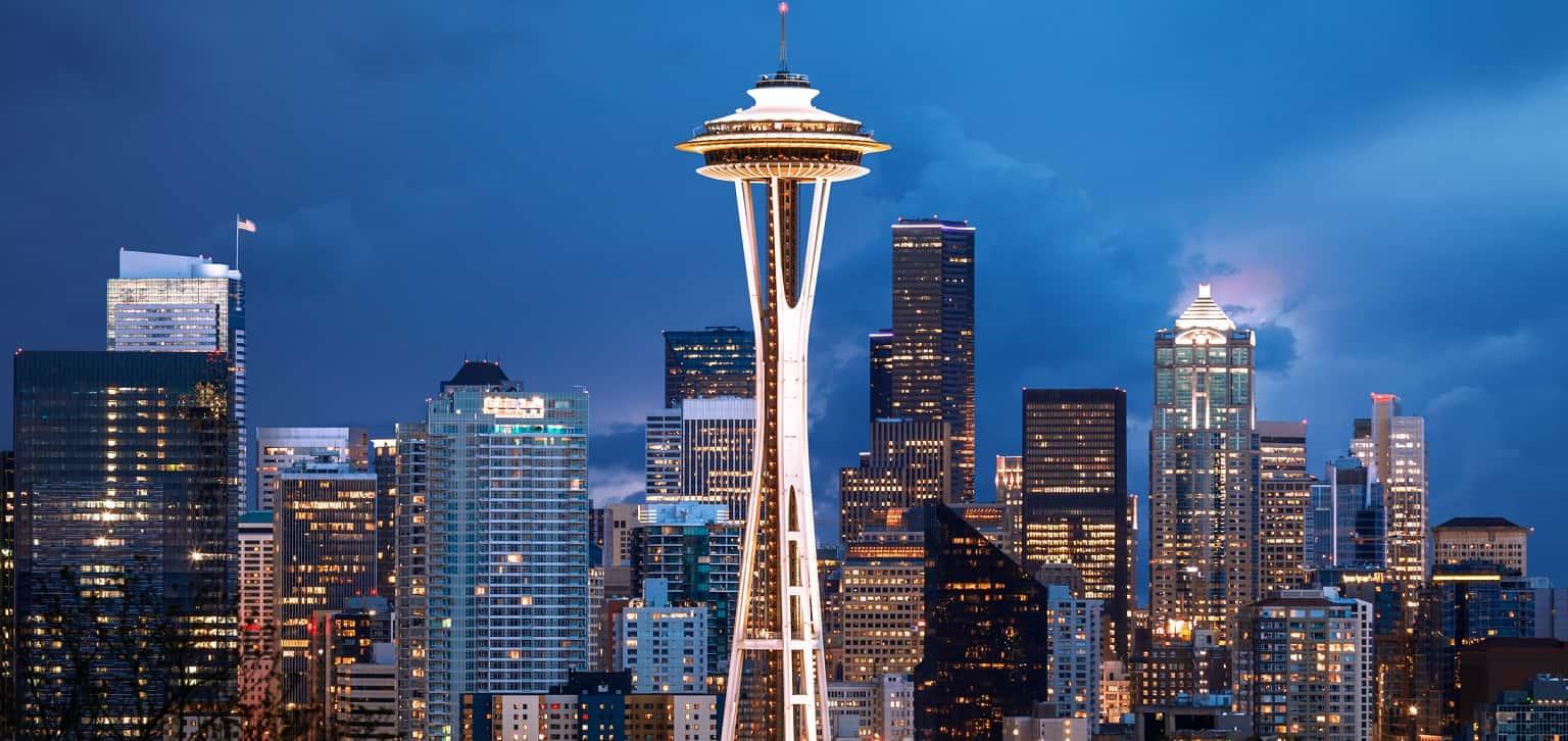 The Space Needle in Seattle takes front and center among a backdrop of the city.