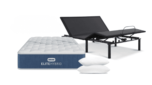 Bear Elite Hybrid mattress next to an adjustable base and two pillows