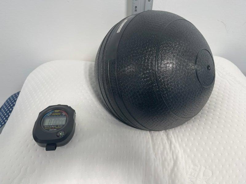 A weighted medicine ball measures the loft difference of the TEMPUR-Symphony pillow.