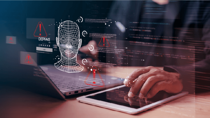 A person uses a tablet beside an open laptop while digital graphics overlay the devices, illustrating a deepfake scam.