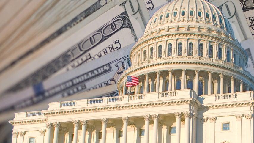 Capitol dome with $100 bills behind it