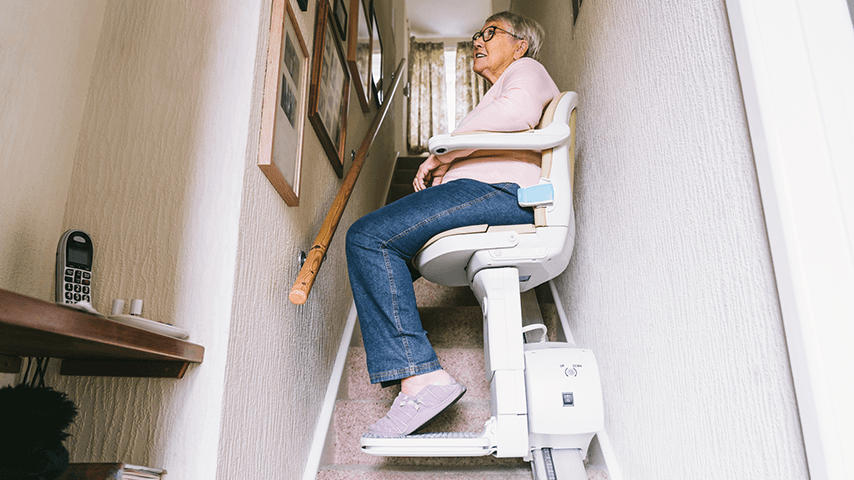 older woman on stair lift