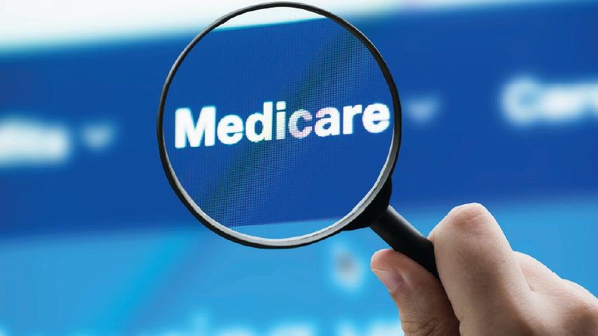 Close up of the words 'Medicare' onscreen, where a magnifying glass is right on top.