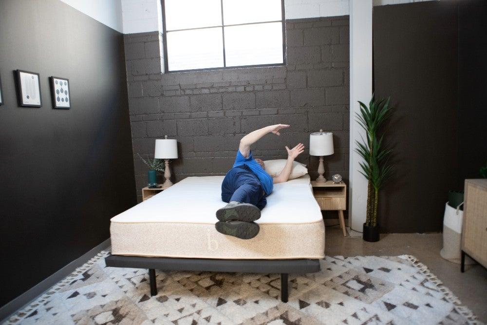 man rolling over on the Birch Natural mattress