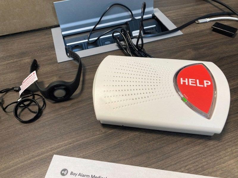 Bay Alarm Home System on a desk plugged in
