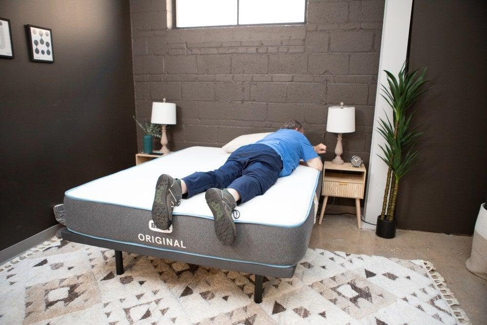 A man lying on his stomach on the Bear Original mattress