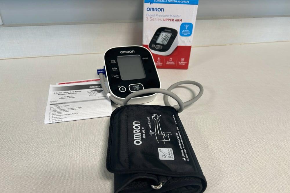 Omron 3 Series blood pressure monitor box, monitor, armband, and instructions